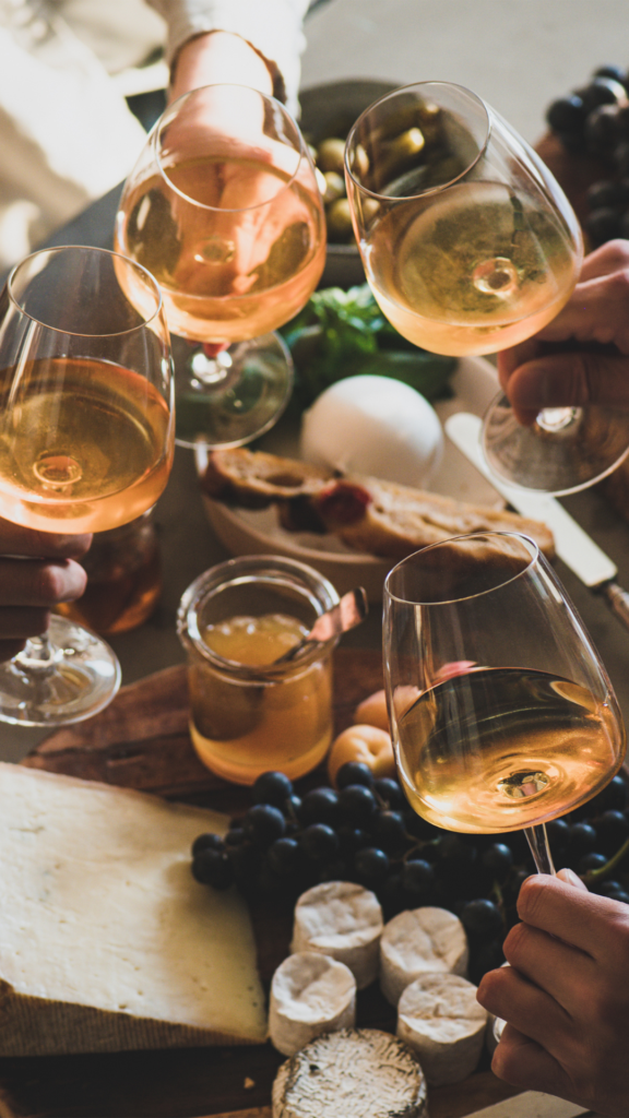 Friends sharing wine over Charcuterie
